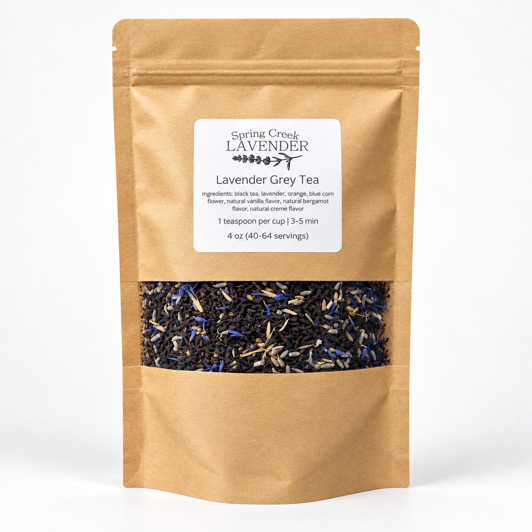 Spring Creek Lavender Grey loose-leaf black tea in a gold 4 oz resealable pouch with a clear window showing lavender buds and blue cornflowers.