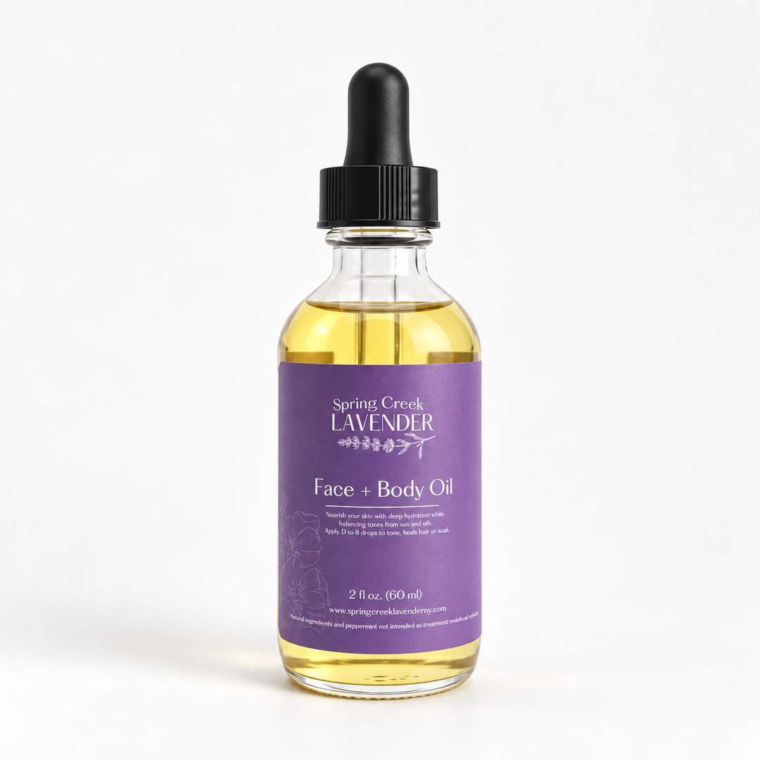 Spring Creek Lavender Face & Body Oil in a glass bottle with a purple label, featuring a nourishing botanical oil blend for skin care.