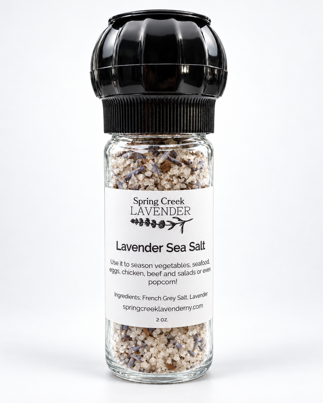 Spring Creek Lavender Sea Salt in a 2 oz clear glass grinder with black top, containing French Grey Sea Salt and dried lavender buds.